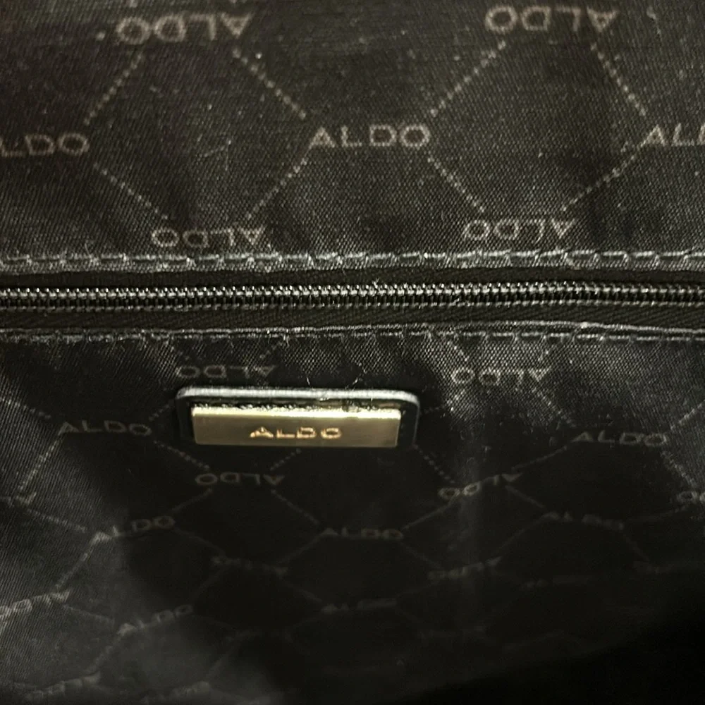 Aldo Faux leather handbag. Shoulder strap missing. Good condition. Black.